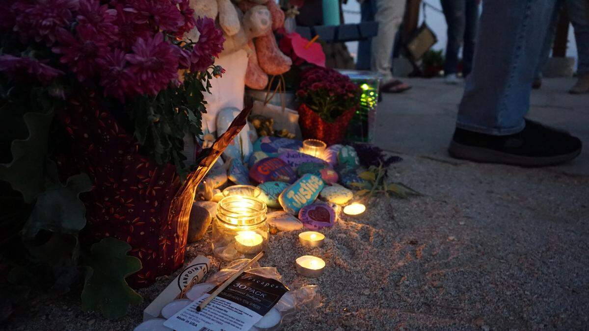 People lit candles and left small gifts at a memorial for Kristin Smart in Shell Beach following the announcement that Paul Flores had been convicted of her murder on Oct. 18, 2022. 