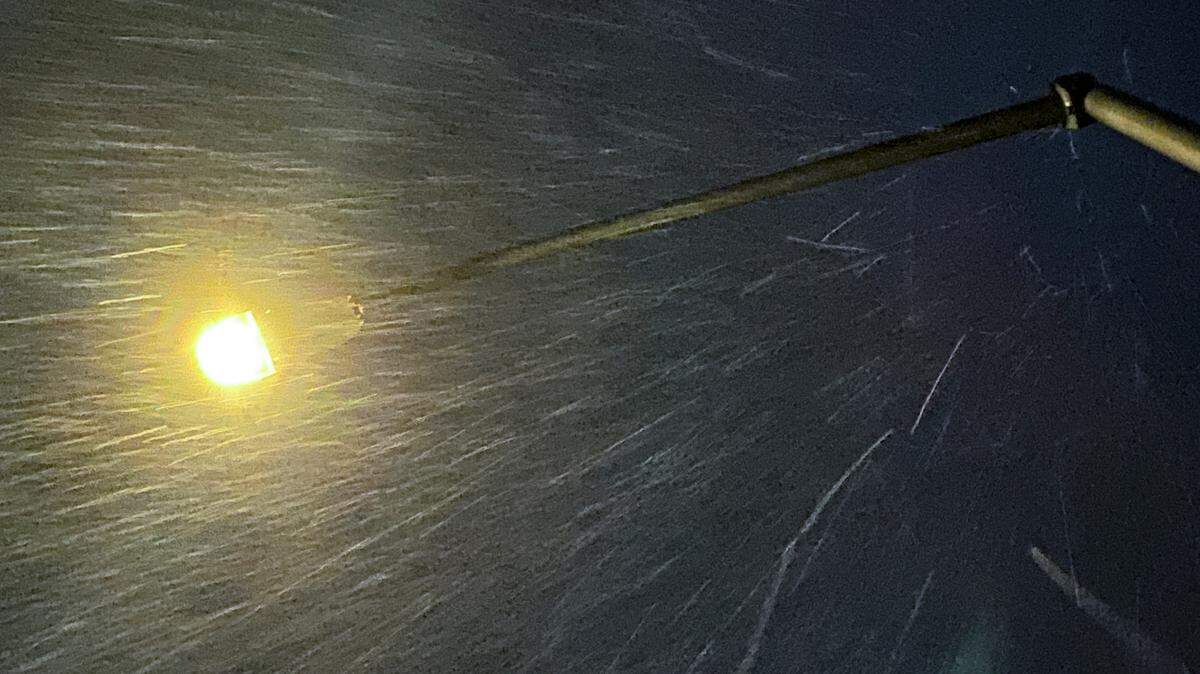 Rain falls after sunset on Margarita Avenue in San Luis Obispo on March 12, 2025.