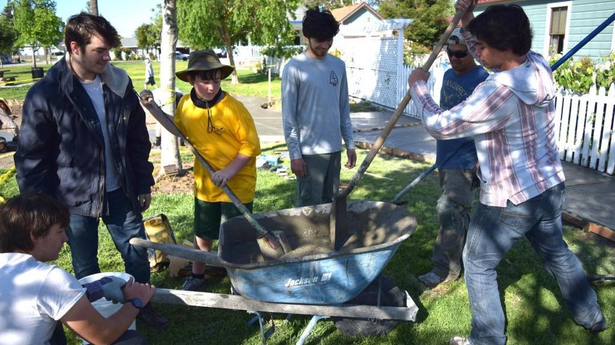 Riley Betita, right, works with his fellow Boy Scouts and Eagle Scouts to build a farm-themed playground at Heritage Park in Arroyo Grande.