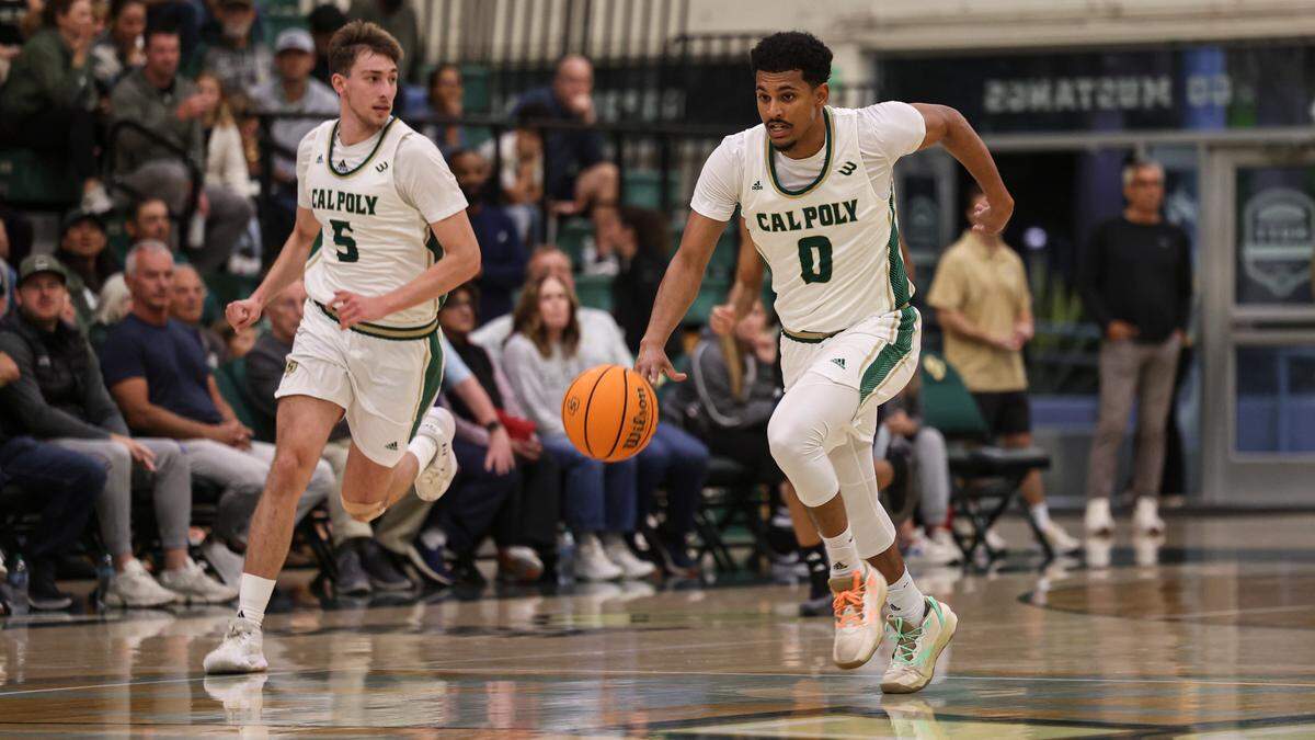 Jarred Hyder drives with ball followed by Guzman Vasilic. Irvine beat Cal Poly 98-89 in an overtime men’s baskeball game Jan. 2, 2025.