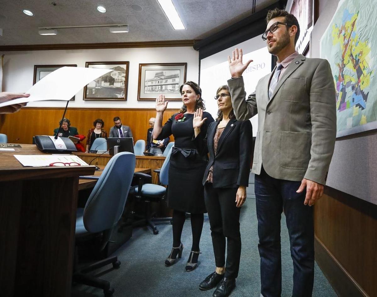 Incoming San Luis Obispo Mayor Heidi Harmon, left, city Councilwoman Andy Pease and Councilman Aaron Gomez are sworn into office by the City Clerk Carrie Gallagher in 2016.