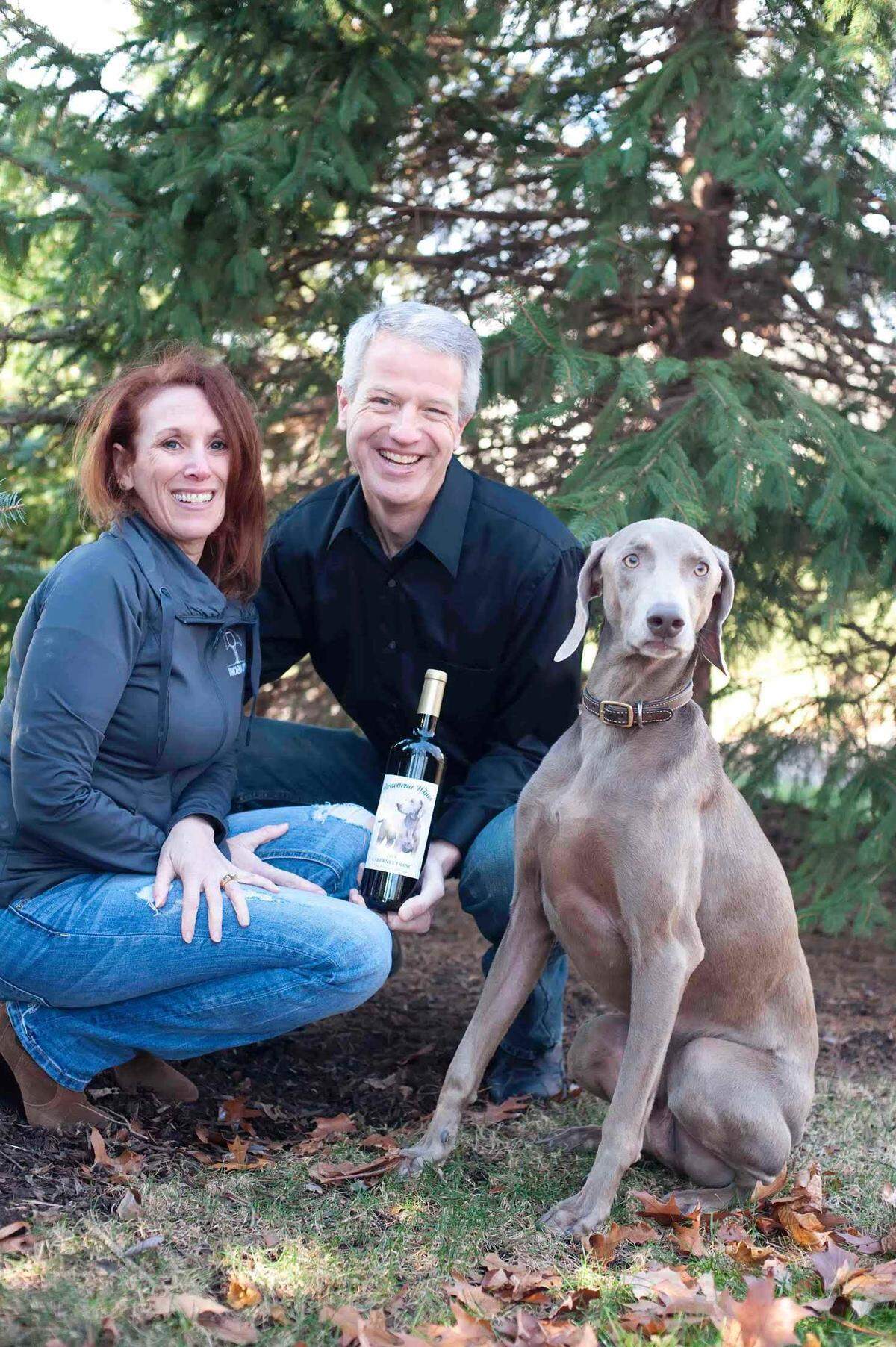 Dracaena Wines owners Lori and Michael Budd pose with their dog, Vegas. Dracaena Wines opened a tasting room in downtown Paso Robles in March 2023.