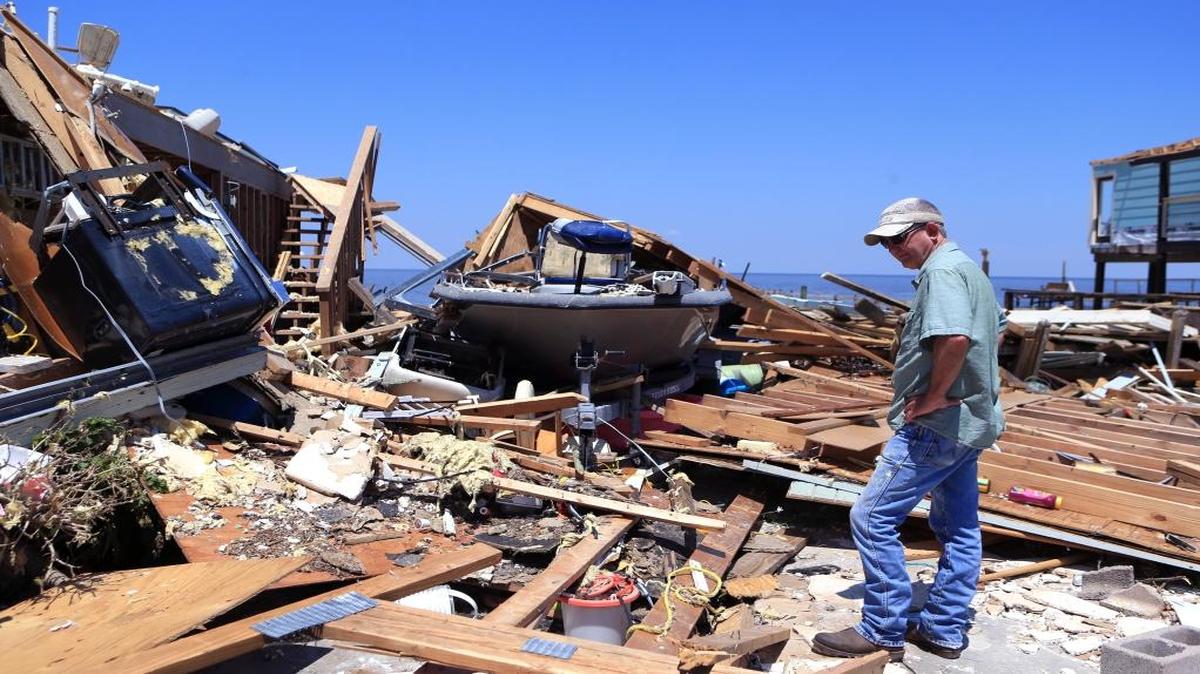 Kim Weatherford surveys the damage at his vacation home in Copano Cove in Rockport, Texas, on Wednesday, Aug. 30, 2017.