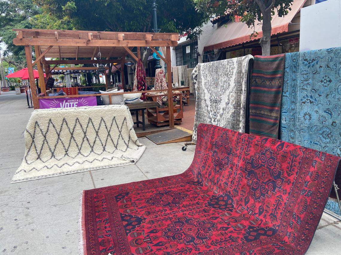 A store that sells rugs on State Street in Santa Barbara displays its product outside.