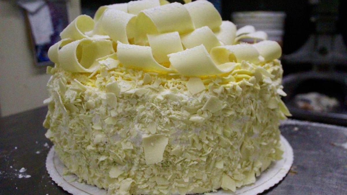 A pink champagne cake in the Madonna Inn’s kitchen. Madonna is facing a pink chocolate shortage and has been using cream-colored shavings and crumbles to garnish cakes.
