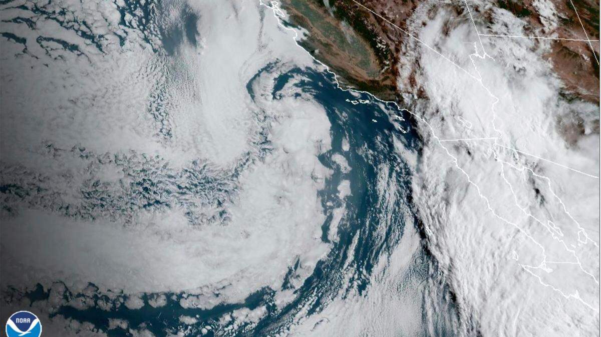 This Saturday, Aug. 19, 2023, 8:38 a.m. satellite image provided by the National Oceanic and Atmospheric Administration shows Hurricane Hilary, right, off Mexico’s Pacific coast.  Hurricane Hilary headed for Mexico’s Baja California on Saturday as the U.S. National Hurricane Center predicted “catastrophic and life-threatening flooding” for the peninsula and for the southwestern United States, where it was forecast to cross the border as a tropical storm on Sunday.