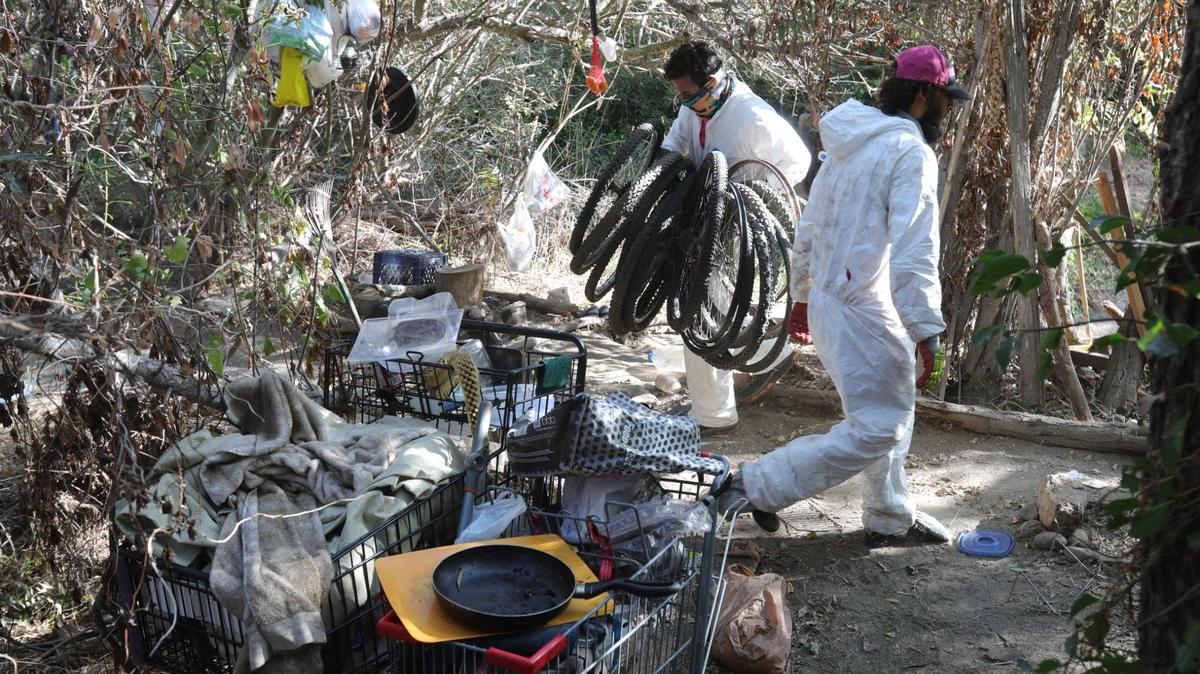 Cleanup of homeless camp along Bob Jones Trail last fall.