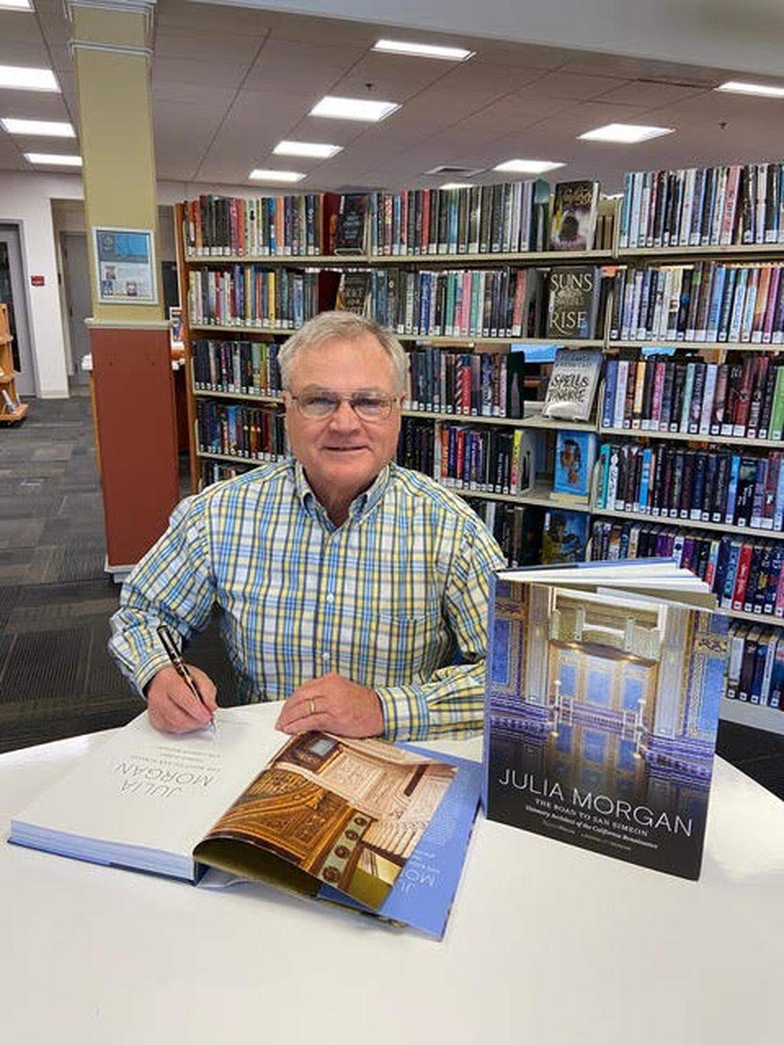 Atascadero author, editor and historian Gordon Fuglie signs copies of a new anthology about Julia Morgan, the visionary architect and designer of Hearst Castle in San Simeon.