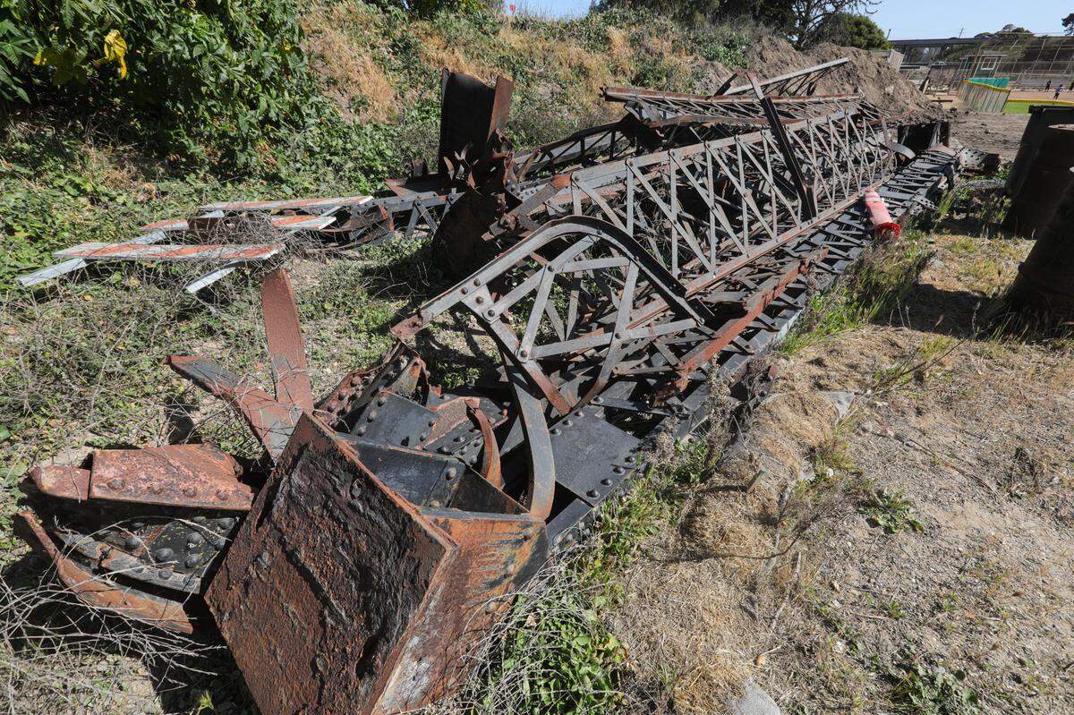Girders of the old Bello Street Bridge sit next to Frady Lane behind the baseball fields.