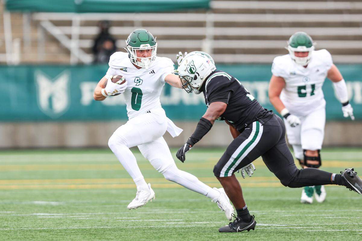 Cal Poly wide receiver Logan Booher (0) runs with the ball after a first-half catch in the Mustangs’ 59-21 loss to Portland State in a Big Sky football game on Sept. 23, 2023, at Hillsboro Stadium.