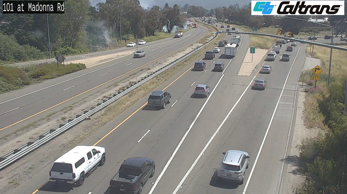 A fire broke out along Highway 101 near Madonna Road following a reported car crash on May 15, 2025.