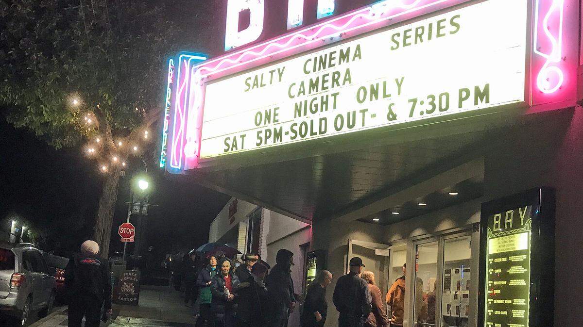 Rain-drenched movie goers begin to queue up for tickets to the second charity screening of the not-yet-released new Beau Bridges film, “Camera,” on Jan. 20, 2024. The second show had to be added because the first one sold out.