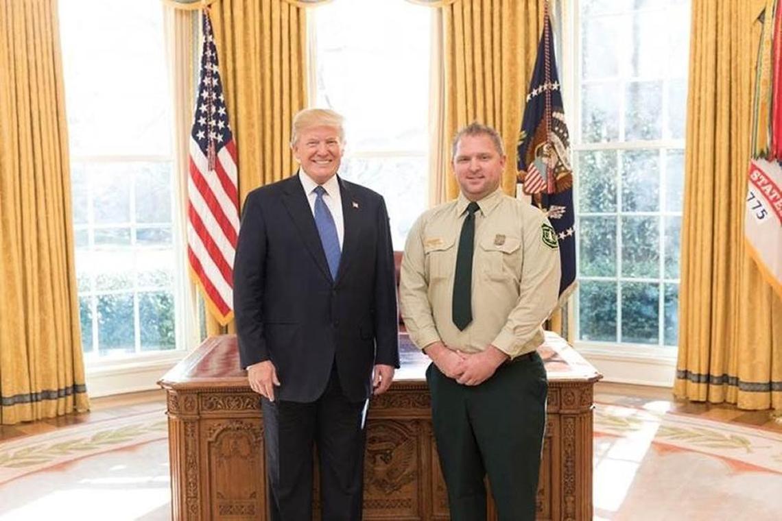 President Donald Trump with State of the Union honored guest David Dahlberg, a fire prevention technician from Santa Maria, in the Oval Office at the White House on Tuesday, January 30, 2018.