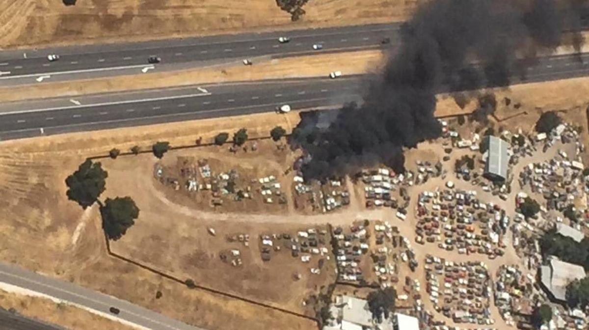 Cal Fire crews battle a salvage yard fire near Paso Robles