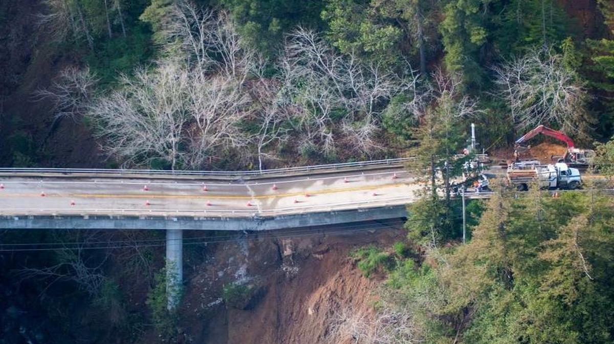 The extent of the damage to the now-condemned Pfeiffer Canyon Bridge along Highway 1 is visible in an overhead photo.