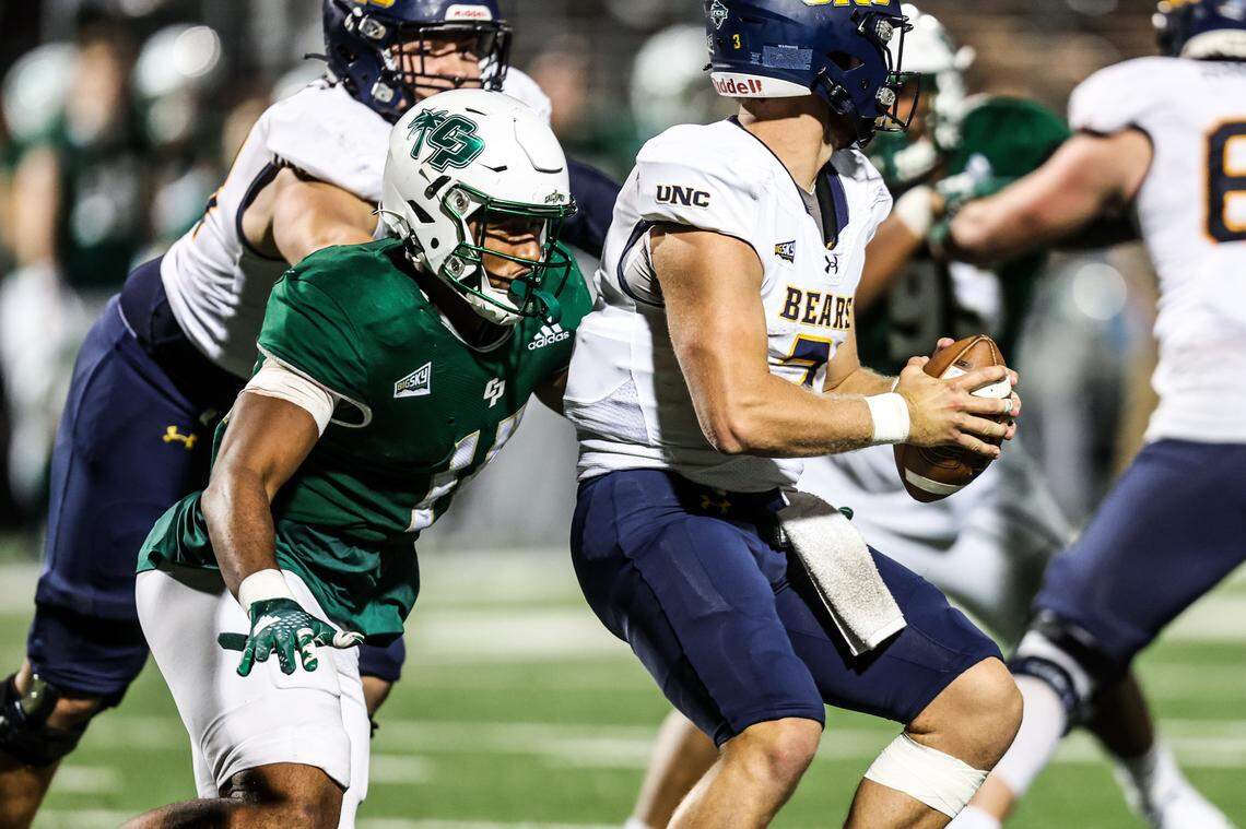 Cal Poly defensive lineman Elijah Ponder (14) sacks Northern Colorado quarterback Jacob Sirmon (3) during the Mustangs’ 24-17 over the Bears on Saturday, Oct. 21, 2023, at Mustang Memorial Field.