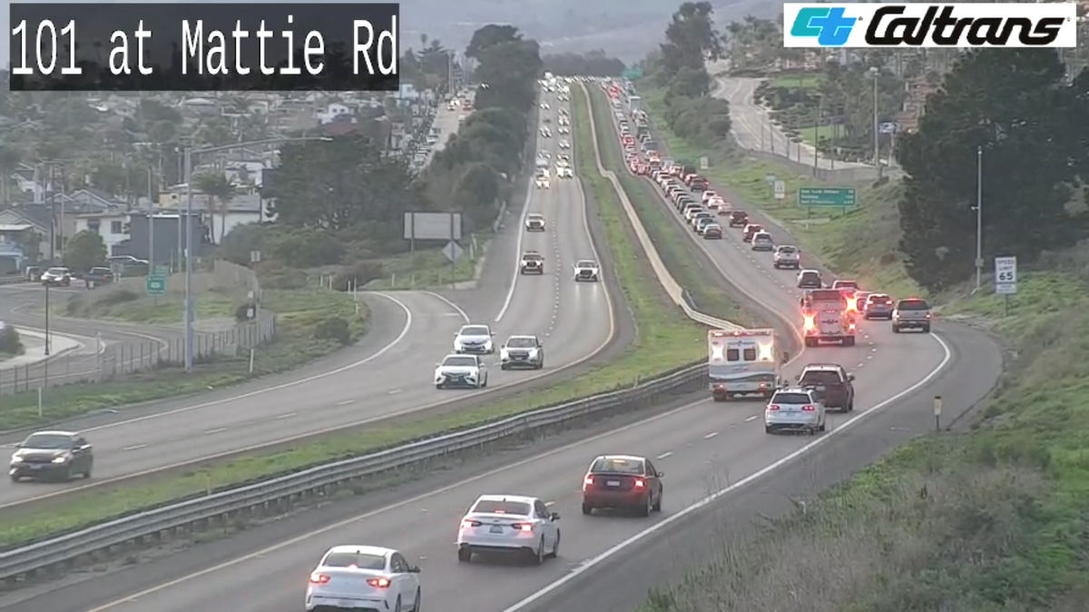 A fire engine and ambulance respond to a rollover crash on northbound Highway 101 as traffic backs up in Pismo Beach on Thursday, Feb. 8, 2024.