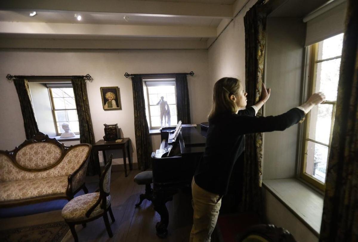 Eva Fina, San Luis Obispo History Center executive director, pictured at a window at the Dallidet Adobe, in 2018. The History Center has terminated its agreement with the Wine History Project, and has returned the Dallidet Adobe and Gardens to its use as a unique historic site open to visitors on weekends in season, and available as a venue for weddings and other community events.