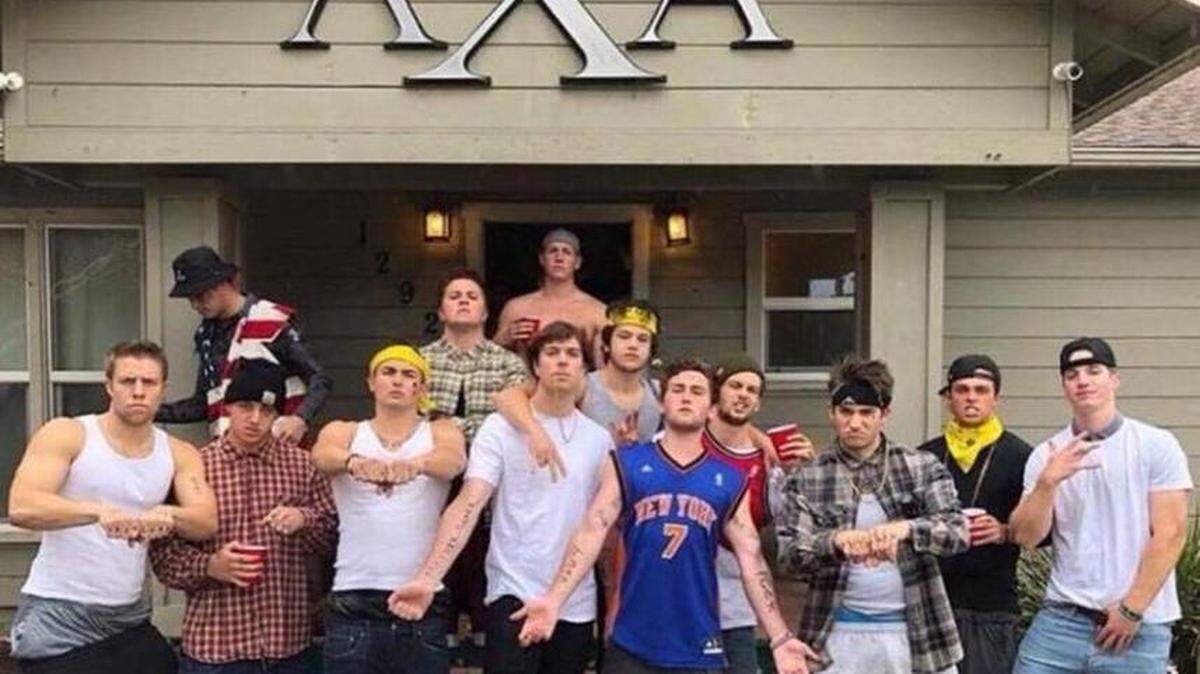 Members of Lambda Chi Alpha are shown dressing as gangster stereotypes and throwing gang signs in front of their fraternity house. The photo was taken Saturday and the Instagram account it's from has been deleted.