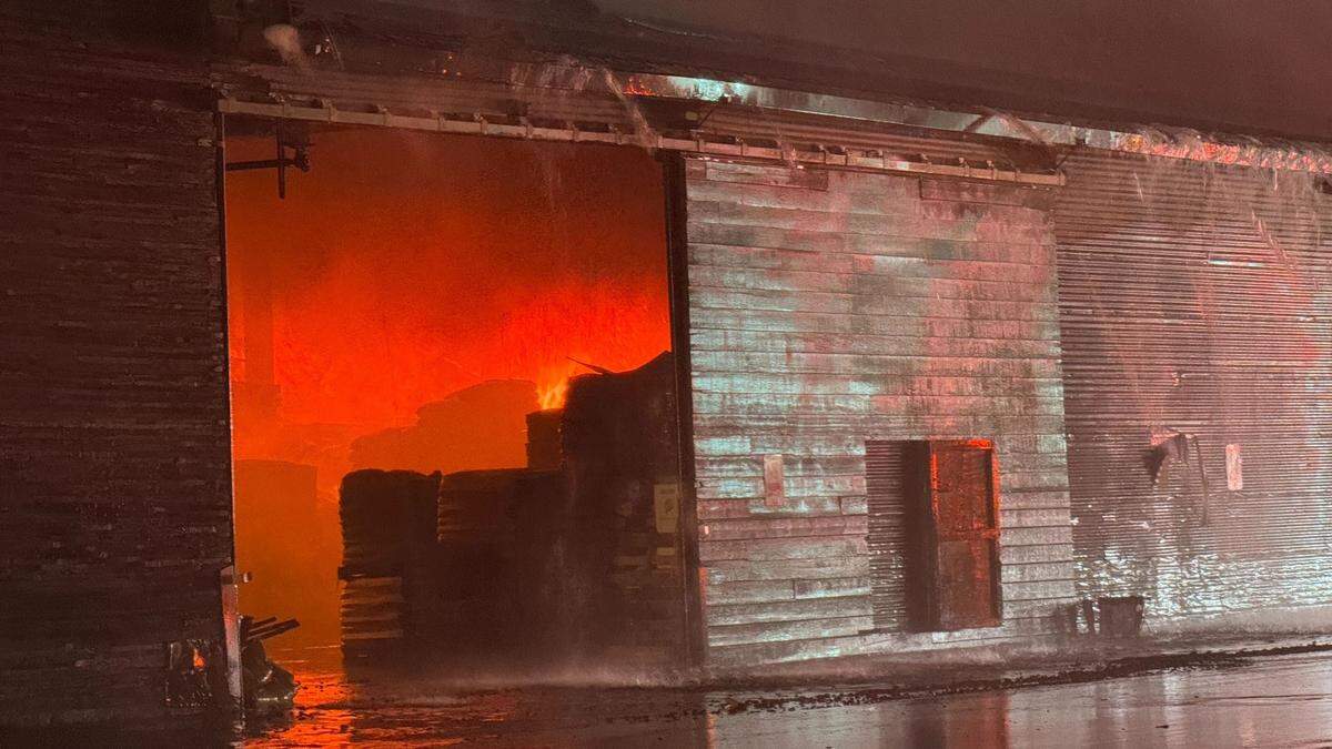 Flames could be seen erupting from an upper floor of Templeton Feed & Grain early July 5, 2025, as firefighters attempted to save the building.&nbsp;
