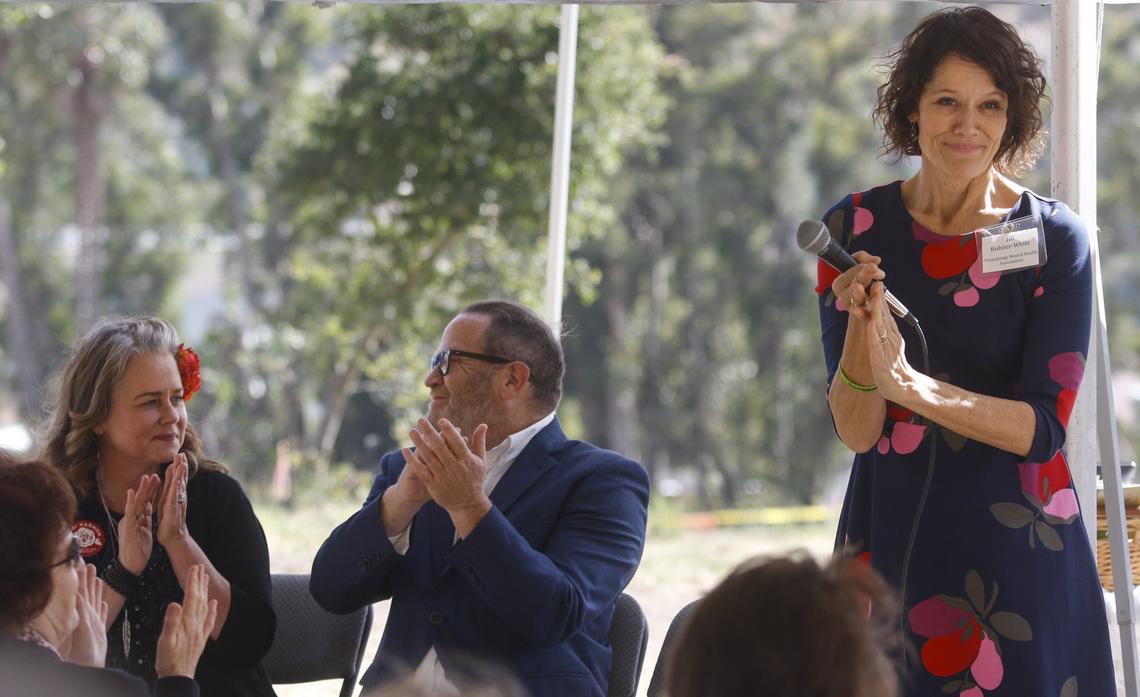 Heidi Harmon, Mayor of San Luis Obispo, Adam Hill, county supervisor and Jill Bolster-White, Executive Director at Transitions - Mental Health Association applaud the efforts of many agencies to get the the Bishop Street Studios project underway in San Luis Obispo. It will have 34 one-person units for people with mental illness.