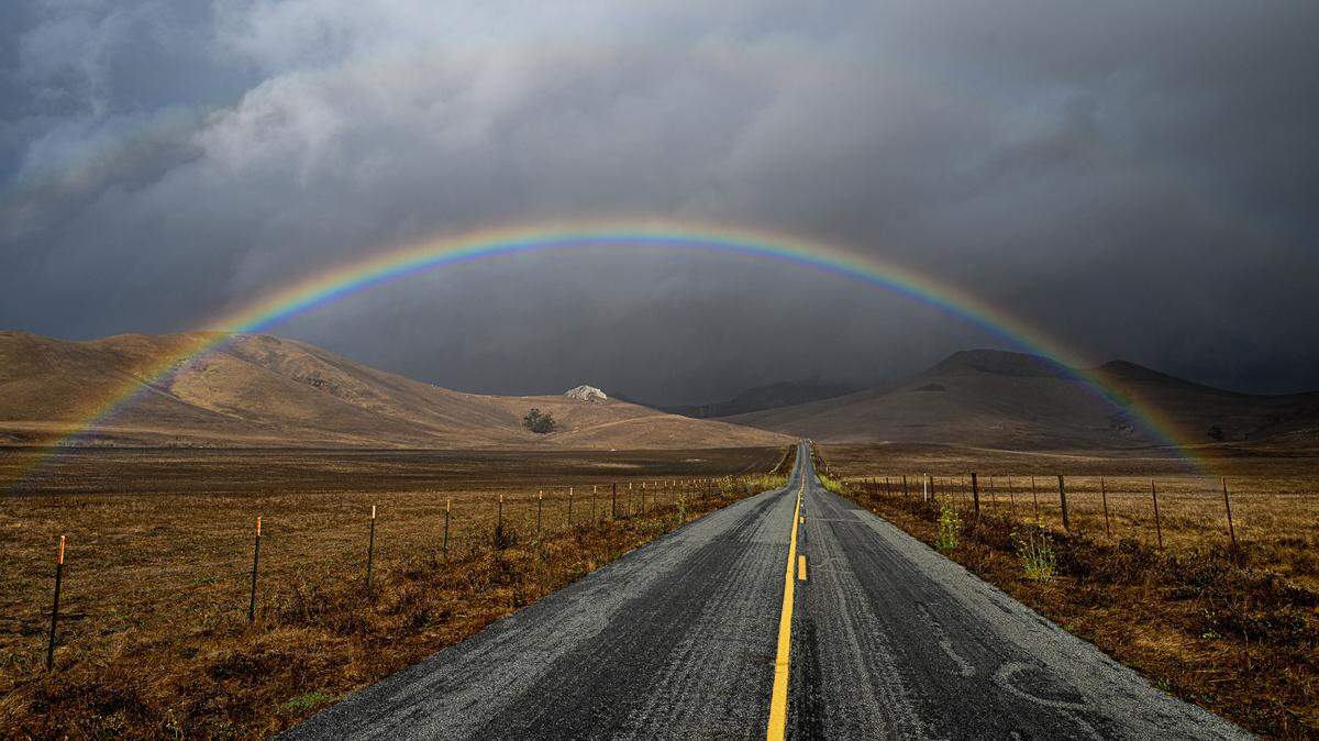 A rainbow stretches across Turri Road near Los Osos.