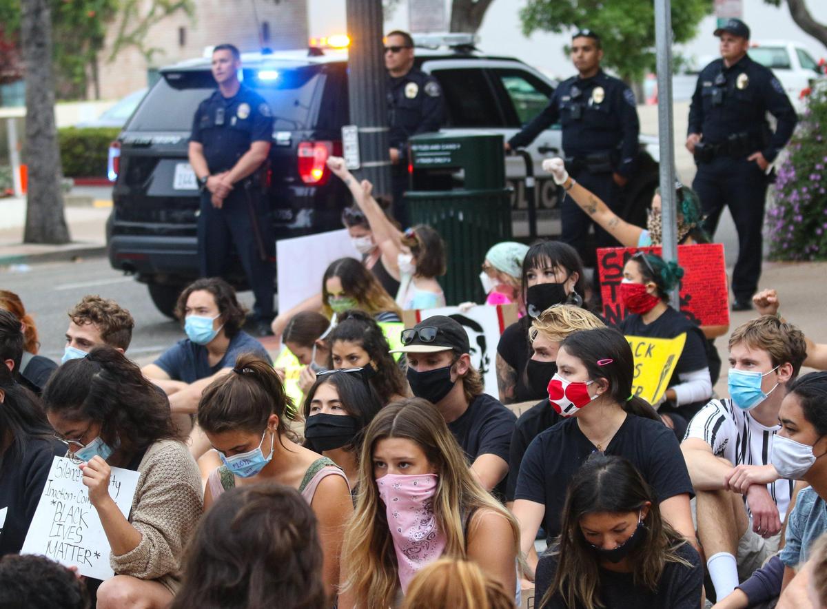 Marchers stopped for almost 9 minutes of silence in memory of George Floyd during a march in San Luis Obispo.