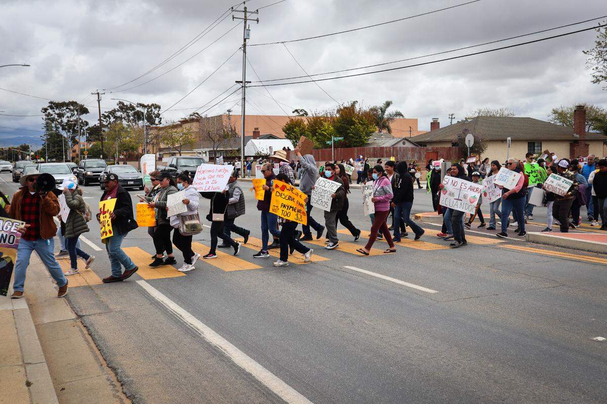 About 80 people protested the Santa Maria Strawberry Festival on April 27, 2025. They called for the Santa Barbara County Board of Supervisors to set a $26 per hour minimum wage for farmworkers.