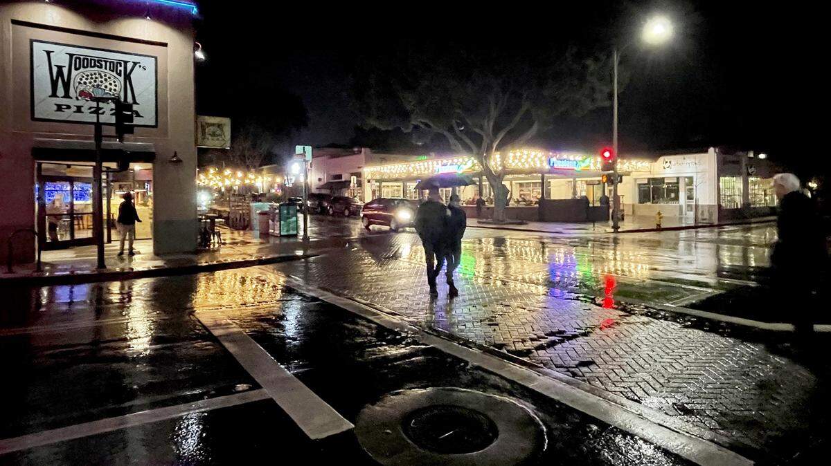 Light rain began falling in downtown San Luis Obispo on Wednesday night, Jan. 31, 2024, as an atmospheric river storm arrived.