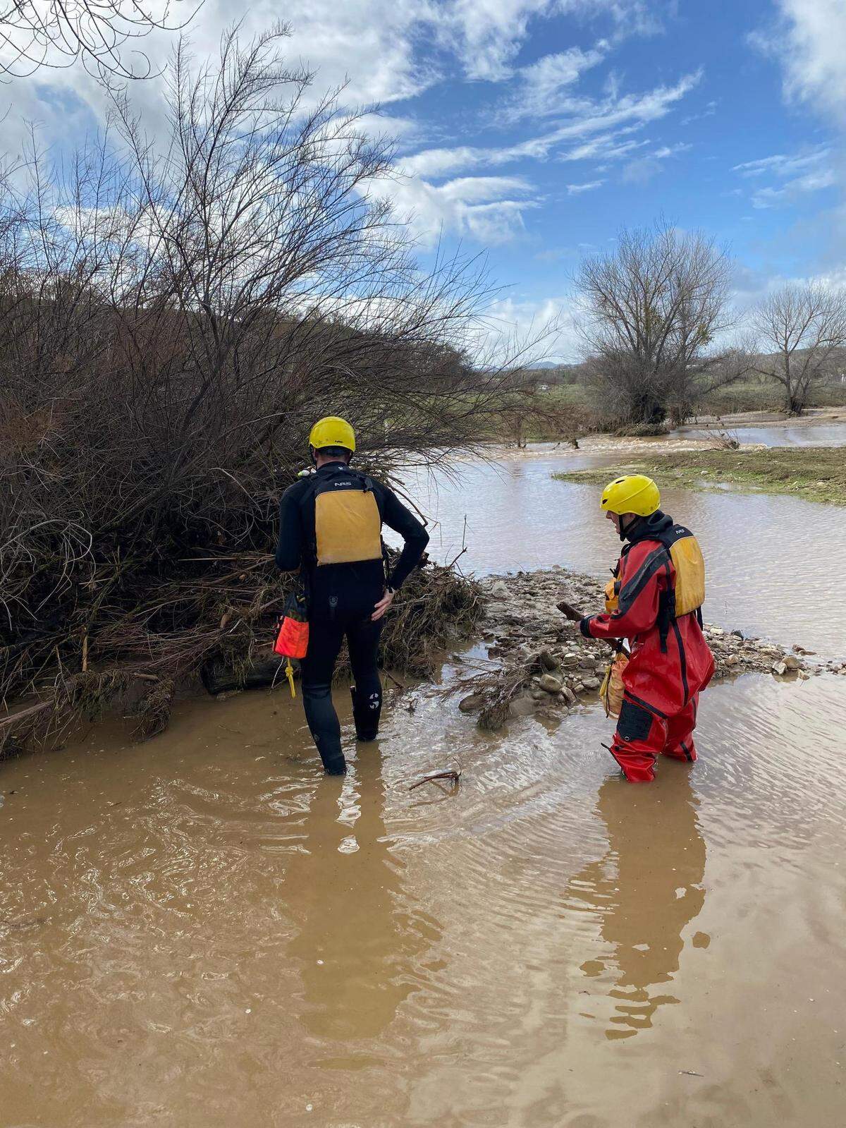 Members of the San Luis Obispo County sheriff’s search-and-rescue team look for 5-year-old Kyle Doan near San Miguel on Tuesday, Jan. 10, 2023. The boy was swept away by floodwaters on Monday.