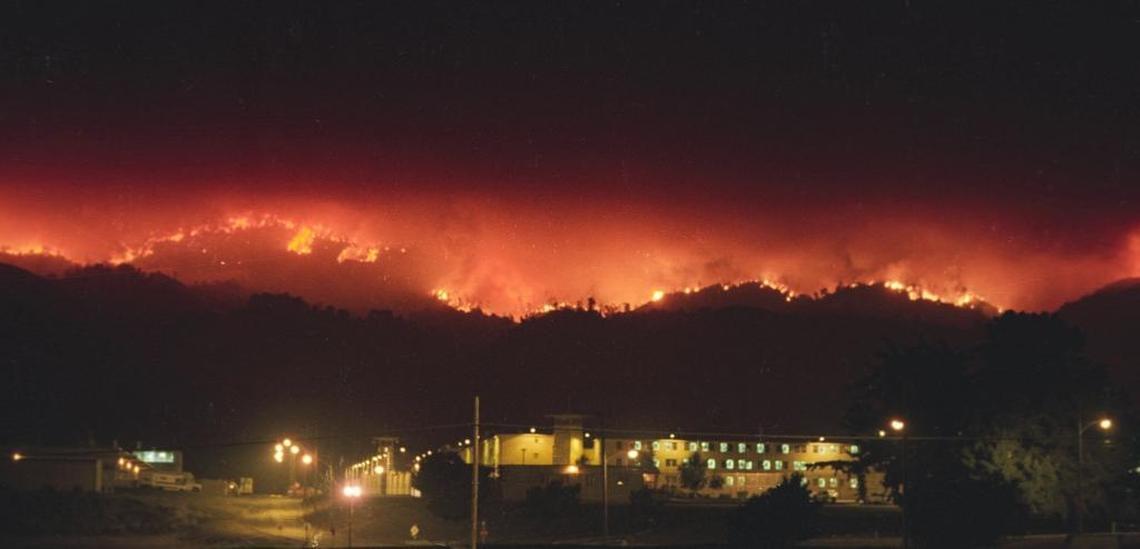 Flames from the Highway 41 Fire burn along the Santa Lucia Range behind the California Men’s Colony the night of Aug. 15, 1994. The fire crossed Cuesta Grade and threatened CMC.