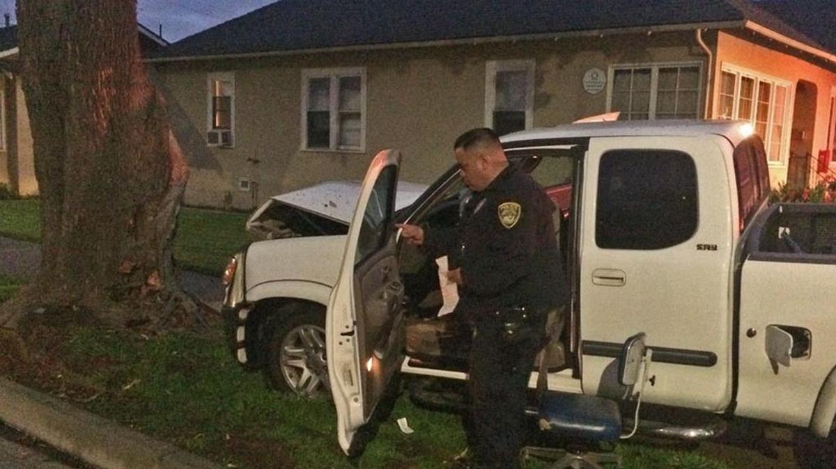 A Santa Maria police officer investigates a single-vehicle accident that occurred November 7, 2017, at the intersection of Miller Street and Chapel Avenue. The driver was taken to the hospital and died two days later.