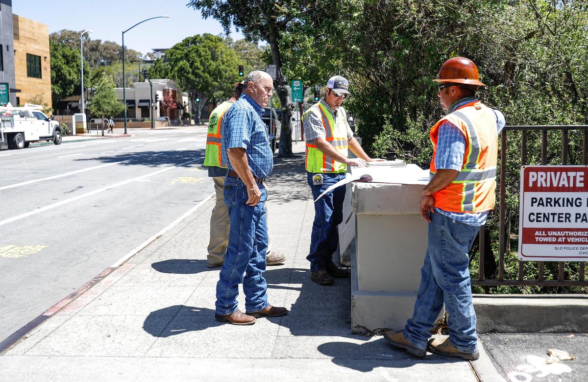 The Marsh Street bridge was first built in 1909. It’s finally being replaced, after years of planning, by the city because of structural deficiencies. The project manager is Jerry Missamore, right. Steve Souza, president of Souza Construction, middle, with his son Stuart Souza, discuss plans on the first day of the construction project.