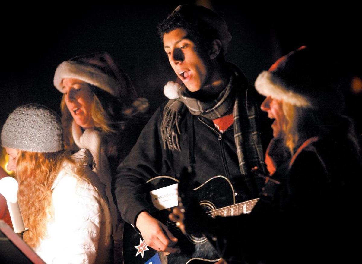 Singers from St. William’s Church perform during the Holiday Musical Walk Around the Lake at the Atascadero Lake in 2007.