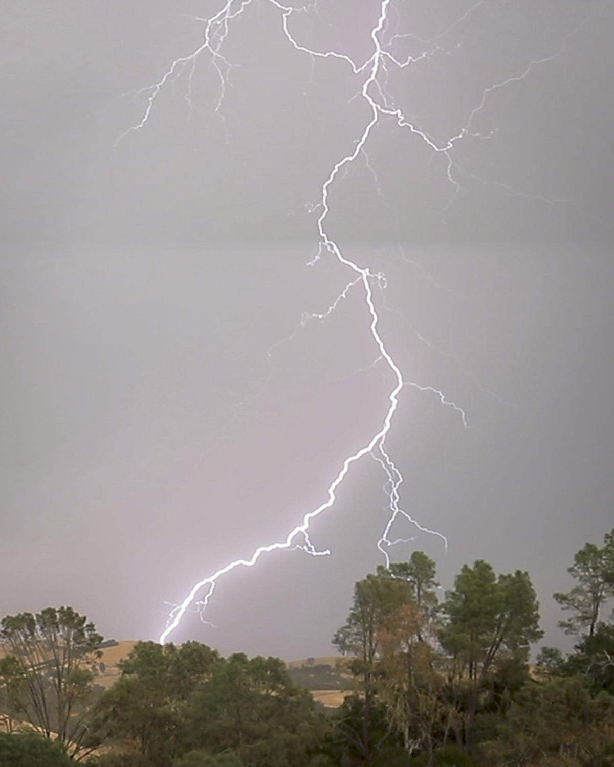 A lightning bolt makes a ground strike east of Atascadero on Sept. 19, 2024, as a thunderstorm moved through the area.