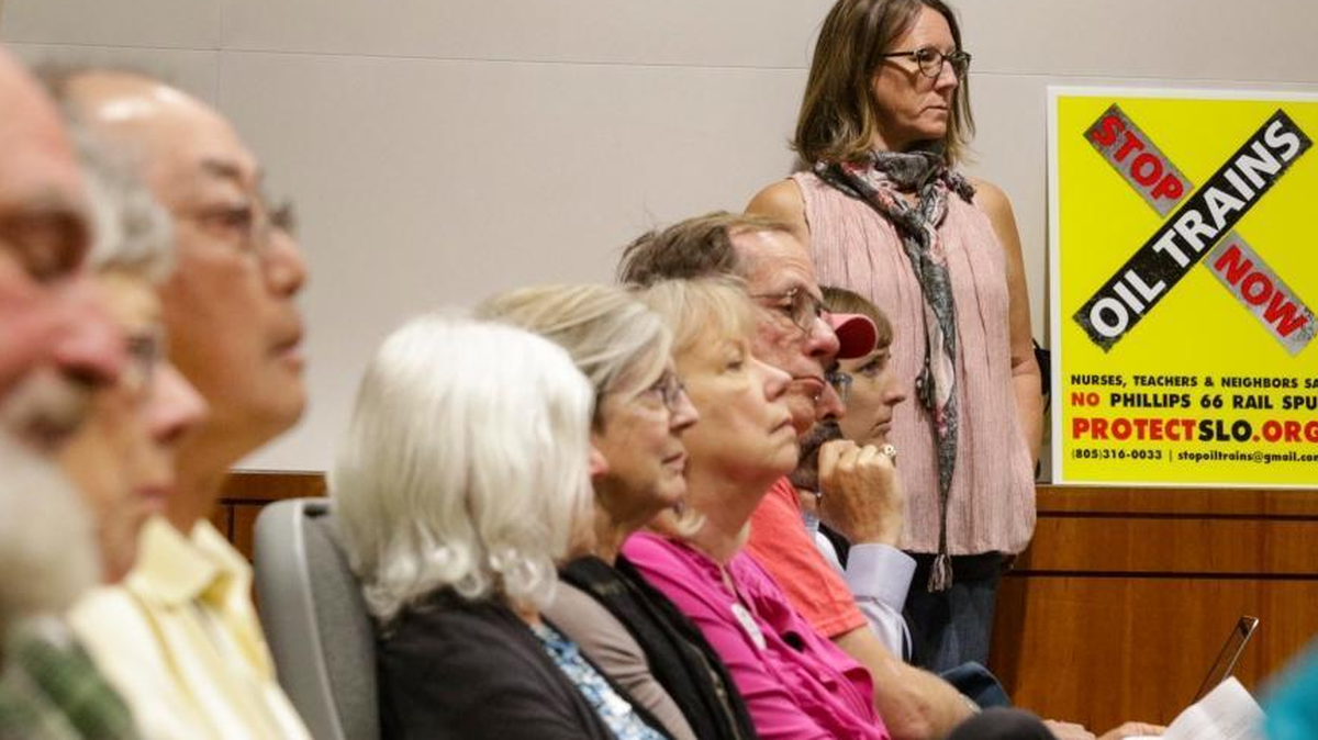 Linda Fitzgerald of Los Osos (standing) was among those who opposed a crude-by-rail project at the Phillips 66 Nipomo Mesa refinery during a San Luis Obispo County hearing last March.