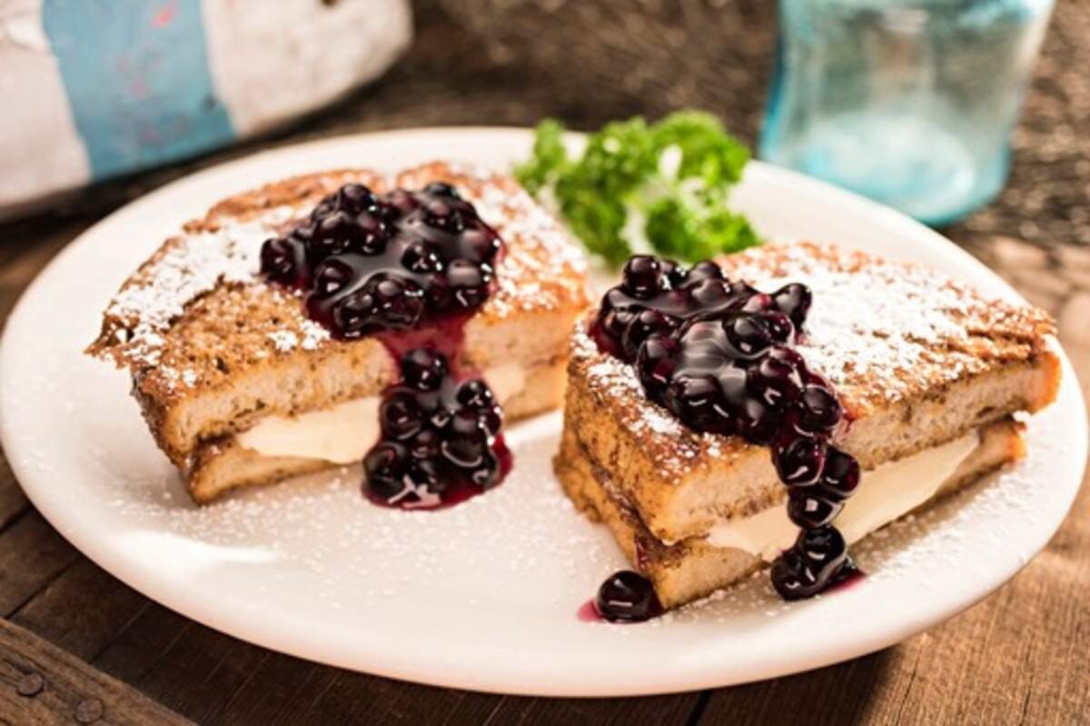 Stuffed French toast at Huckleberry’s breakfast and lunch restaurants is filled with sweet vanilla cream and served with fruit topping, such as this huckleberry compote.