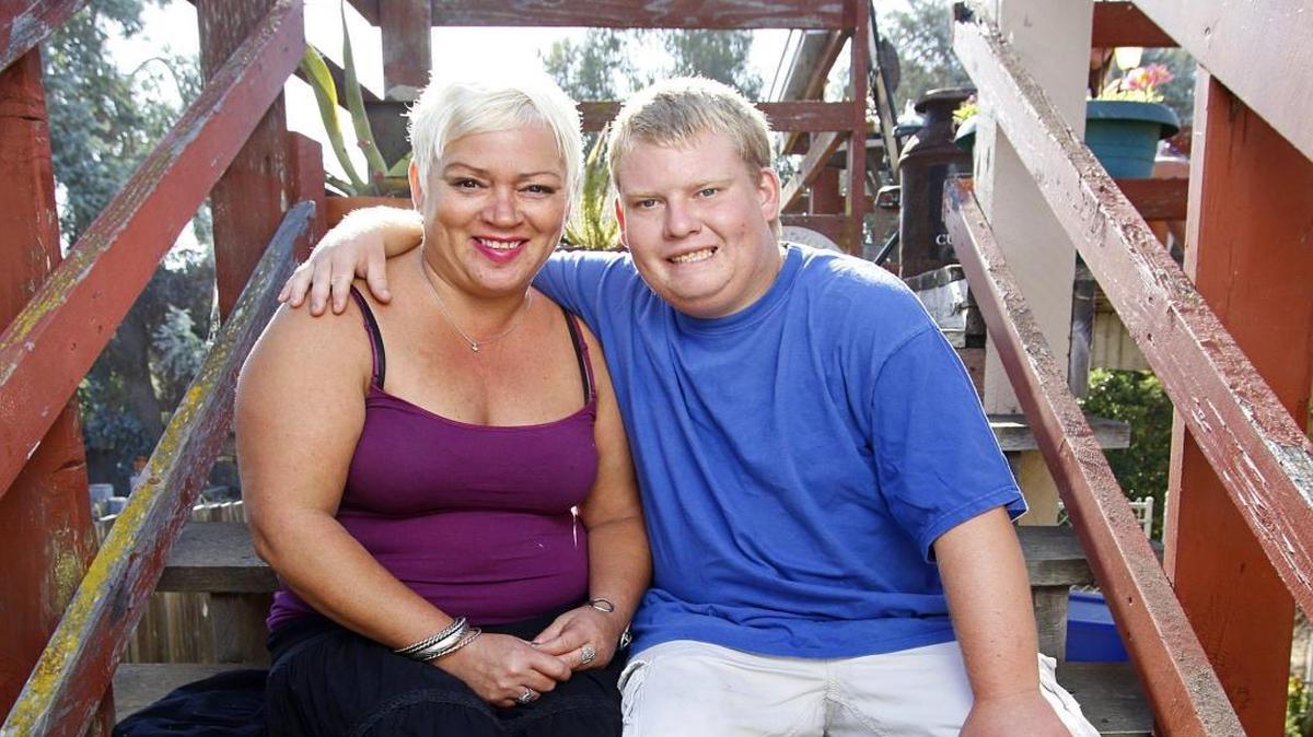 Tyler Jarvis, who has Prader-Willi syndrome, with his mom, Michelle Christian, at their Pismo Beach home.