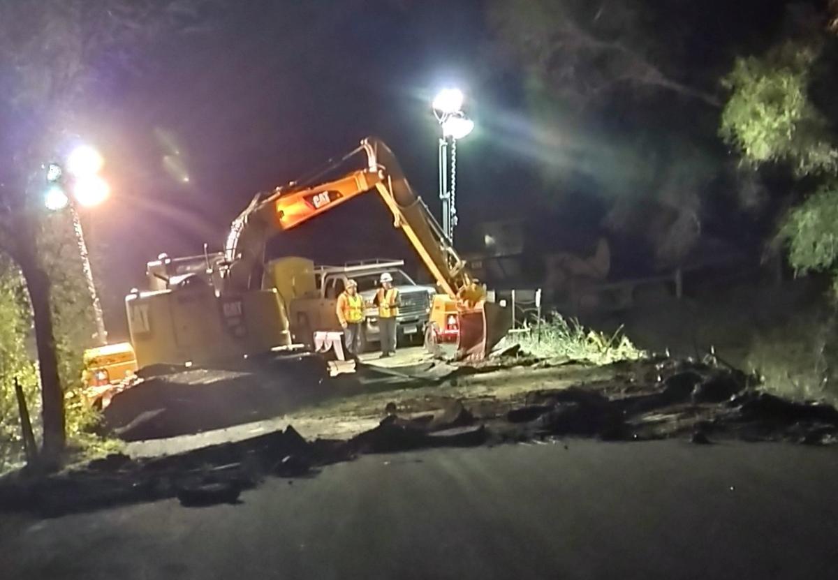 SLO County crews work through the night on a damaged portion of Chimney Rock Road in Paso Robles on Jan. 12, 2023. The road is expected to be closed for two to four months, cutting off access to some residents who live around Nacimiento Lake.