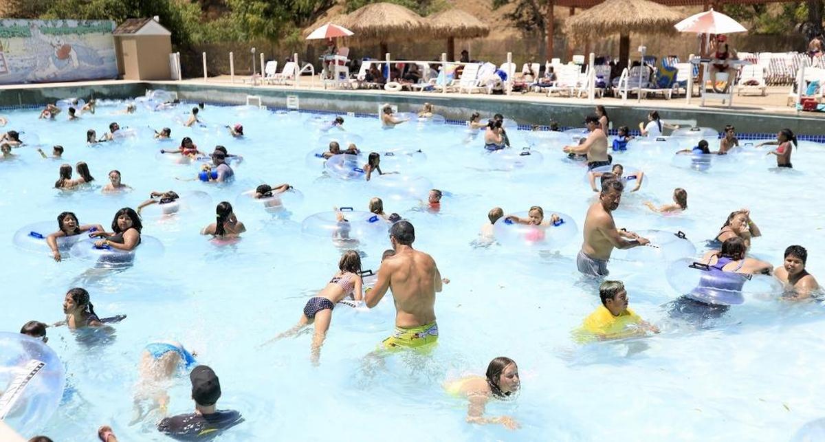 A lot of swimmers cool off Sunday in the Calypso Bay Wave Pool at The Ravine Water Park in Paso Robles.