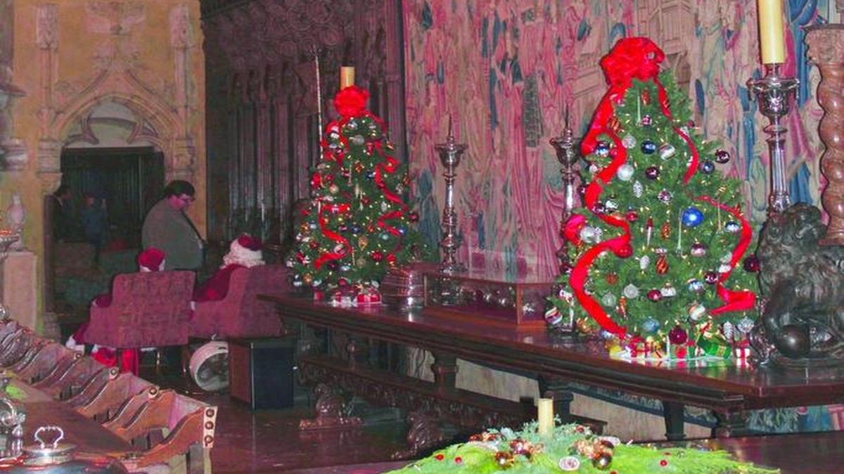 Christmas trees adorn a table in the Hearst Castle dining room. The Castle gets all decked out for the holiday season.