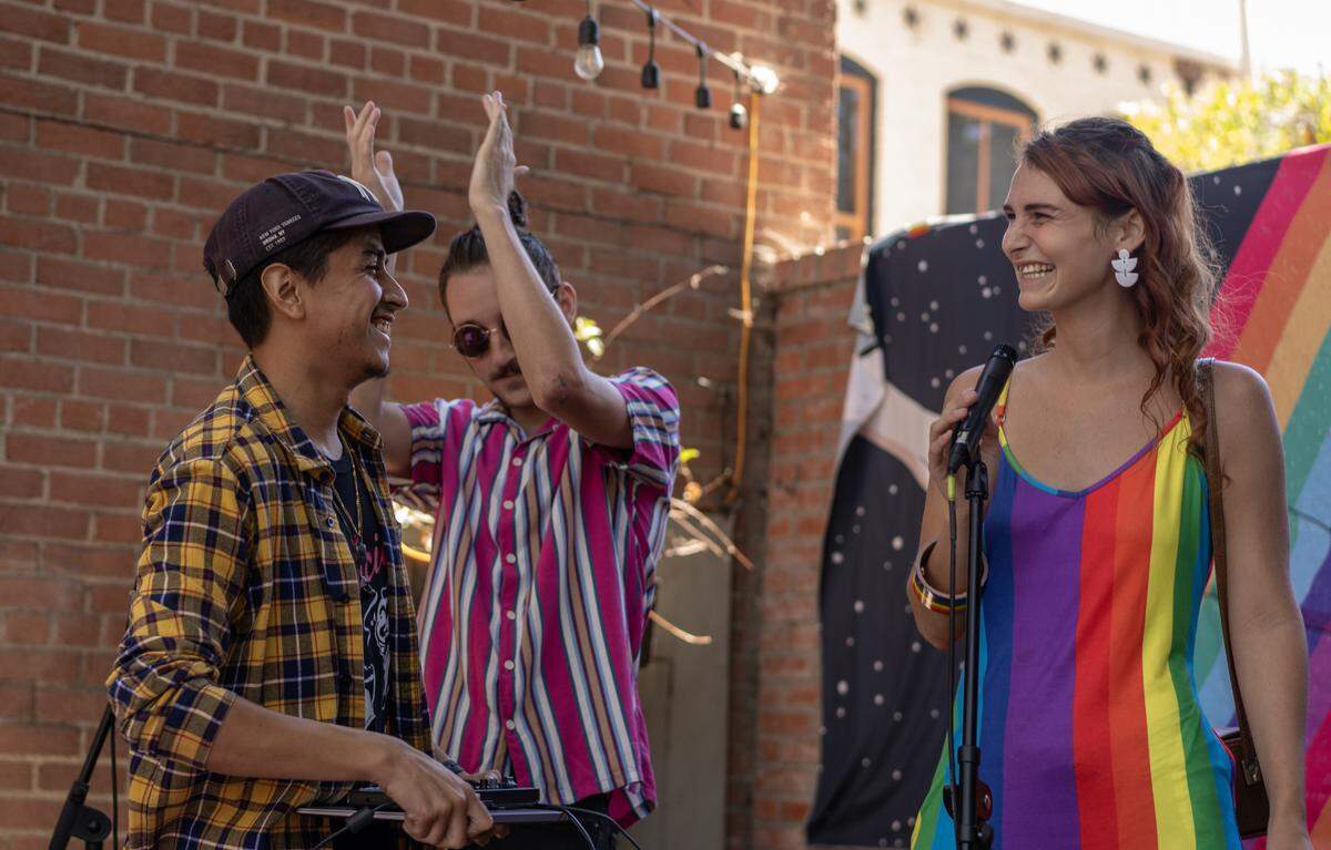 Faith LeGrande, right, introduces local artist Rafa the Unknown to perform at the Art and Soul Fair on Aug. 6, 2022.
