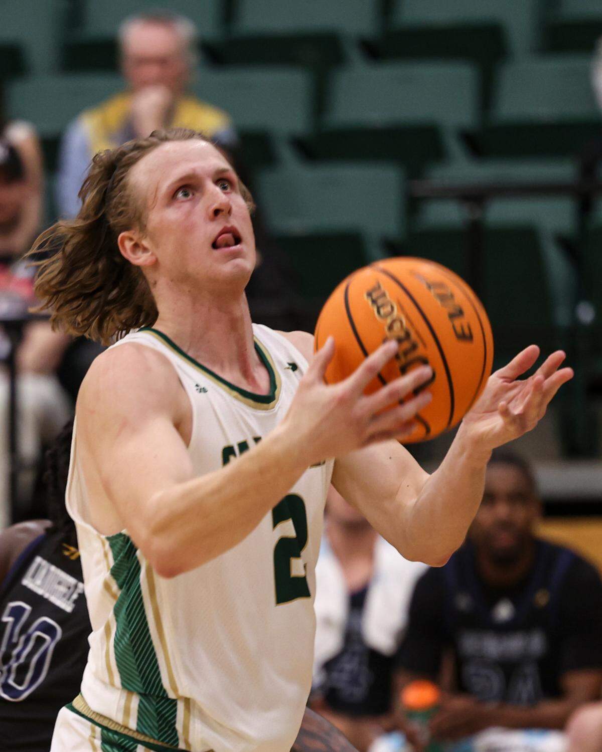 Mac Riniker scoops a shot. Irvine beat Cal Poly 98-89 in an overtime men’s baskeball game Jan. 2, 2025.