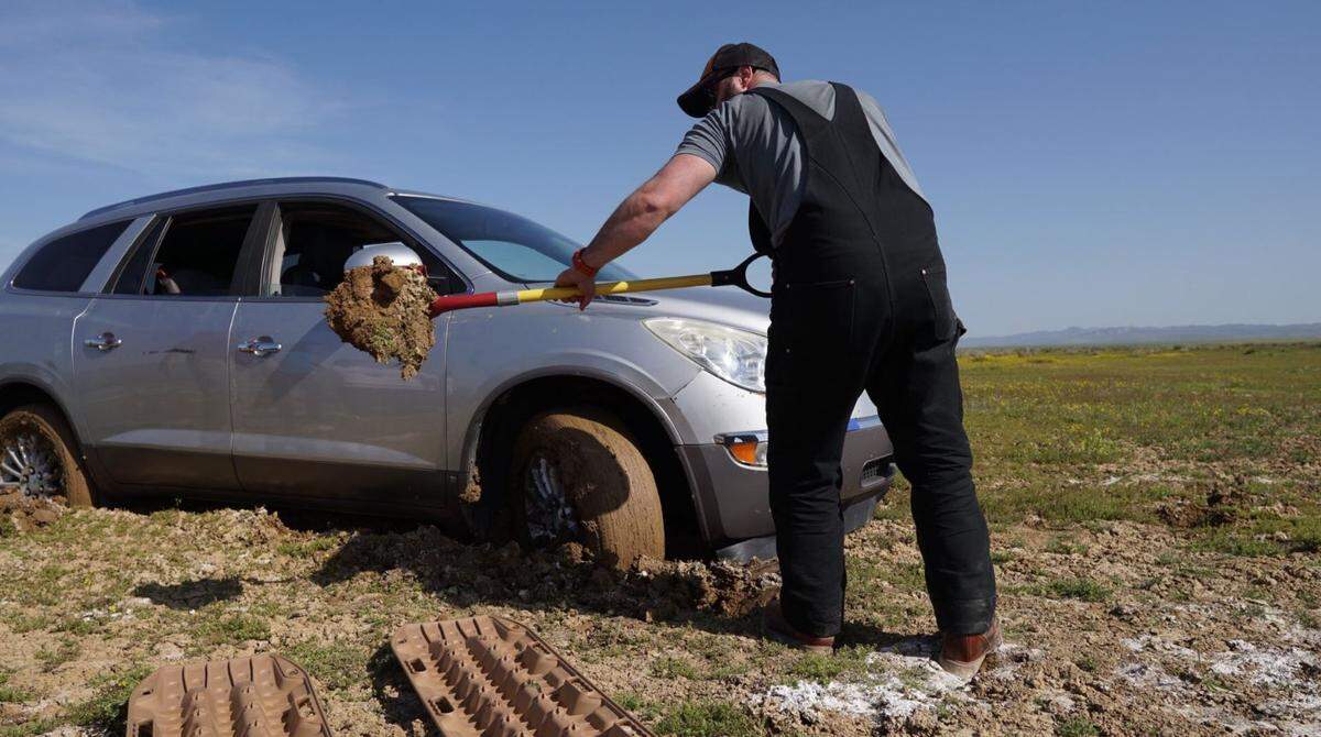 Matthew Wilkins helps retrieve a vehicle stuck in clay mud near the Carrizo Plain National Monument.