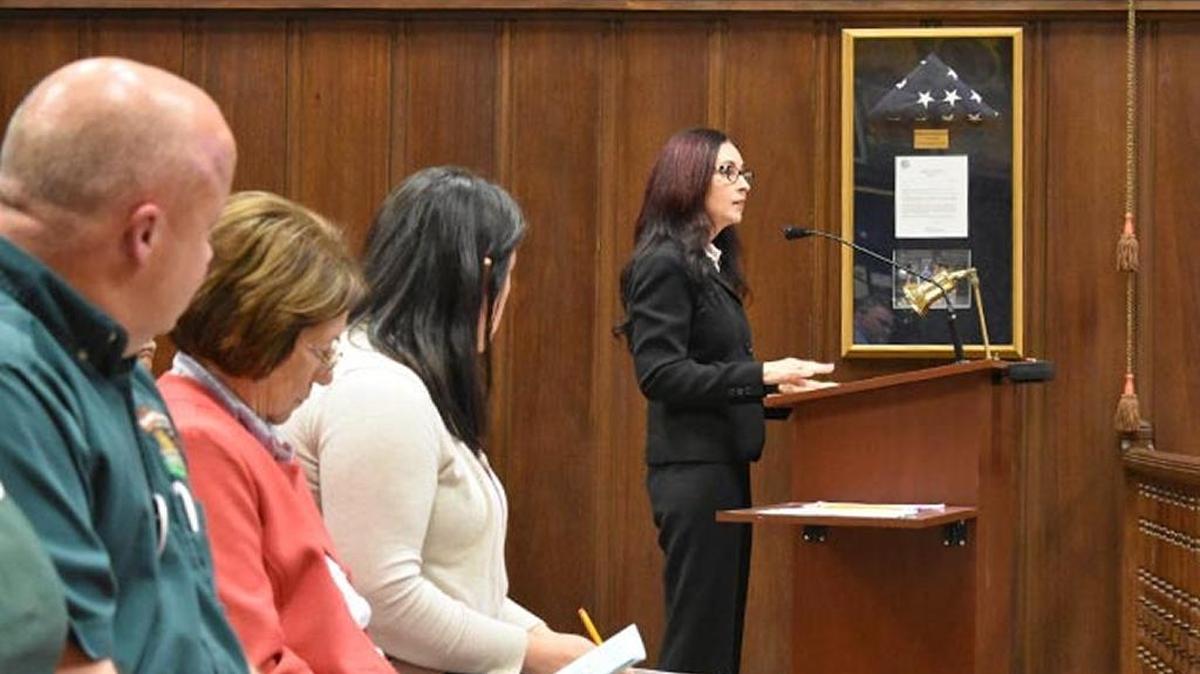 Animal Kingdom Pet Shop co-owner Adam Tipton sits in the front row of the Santa Maria City Council chambers as Cristine Collier asks the council to ban the sale of dogs, cats and rabbits at pet shops.