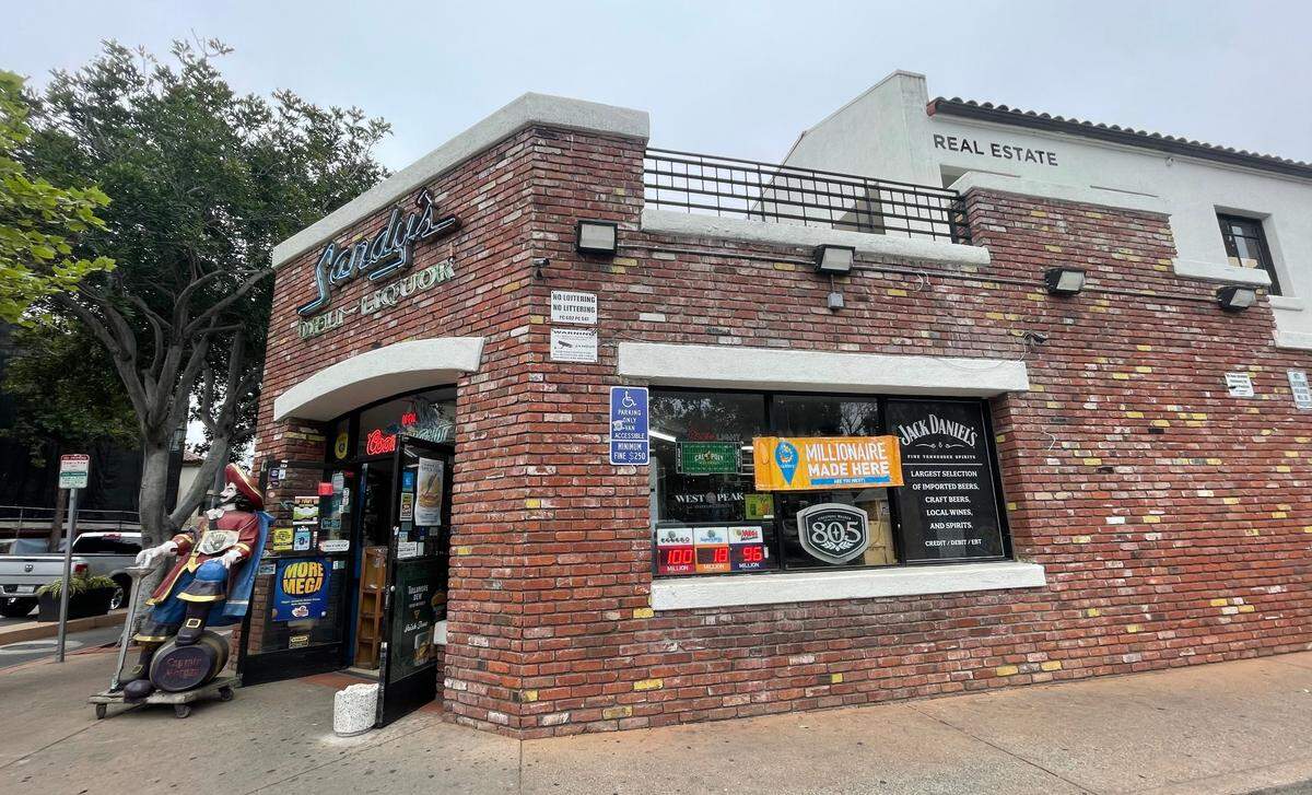 A $1 million winning scratcher was sold at Sandy’s Deli-Liquor in downtown San Luis Obispo on April 6, 2025. A sign in the window of the business proclaims, “millionaire made here.”