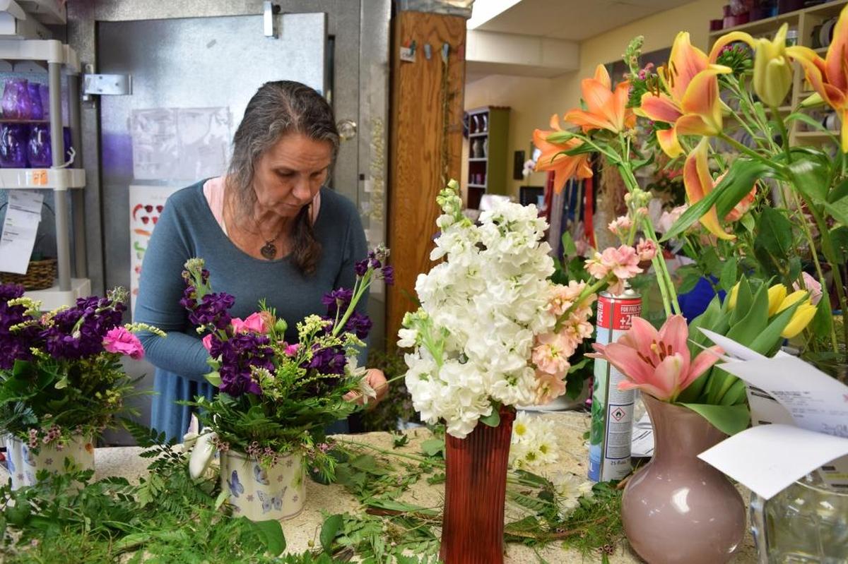 Rose Marie arranges flowers at Albert’s Florist in San Luis Obispo during the Mother’s Day rush.