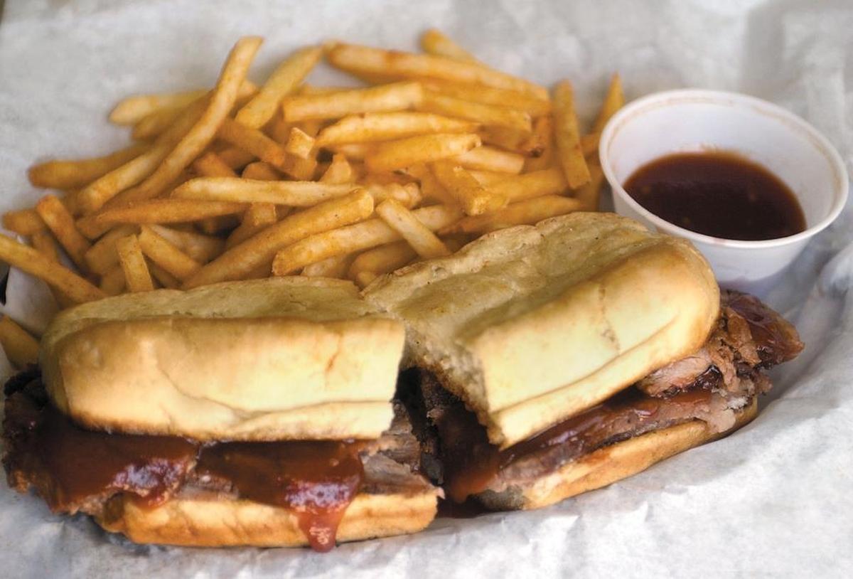 Firestone Grill’s tri-tip sandwich with fries and BBQ sauce.