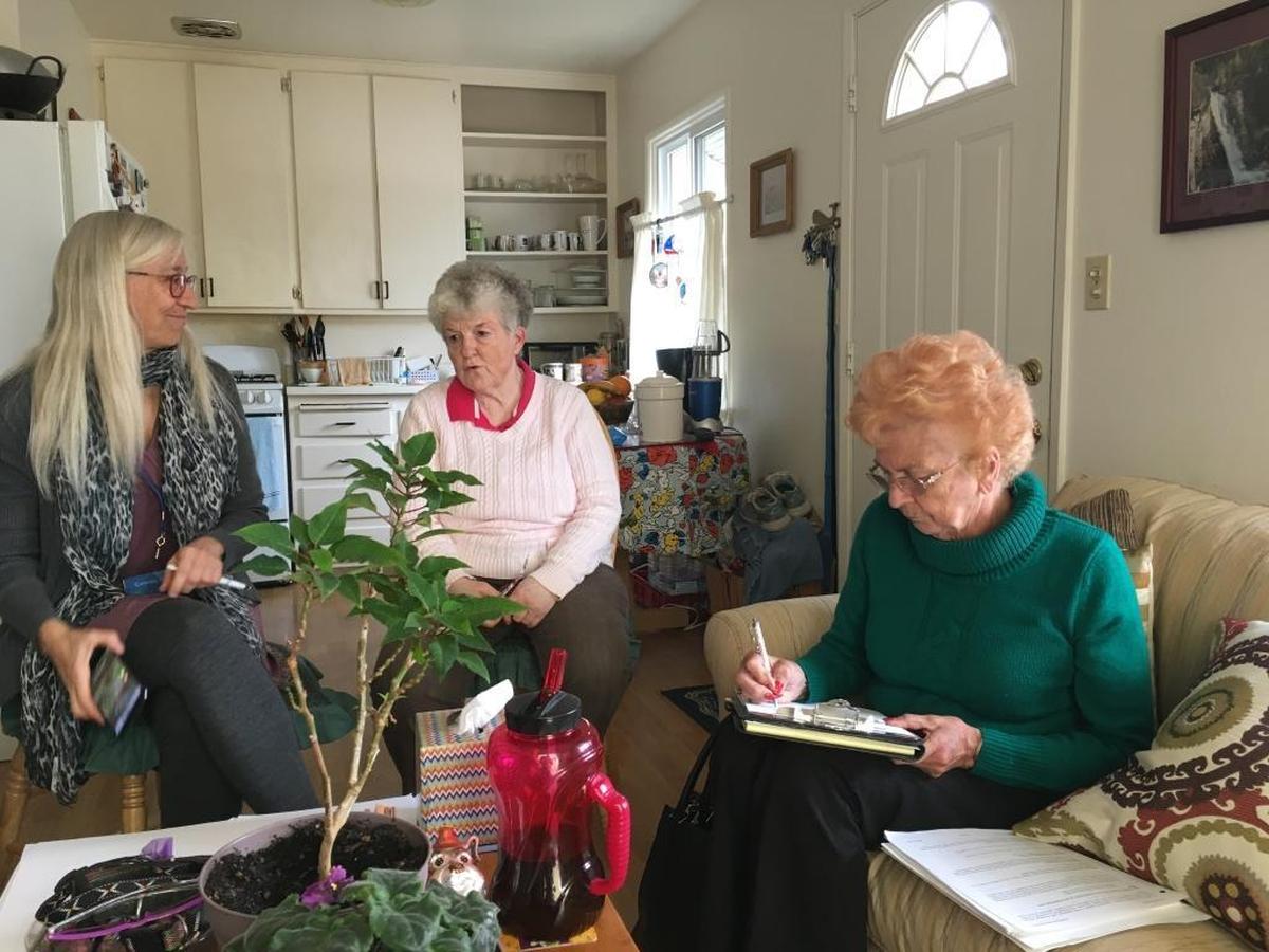 Morro Bay housemates Diann Adams and Betty Norgord sign HomeShareSLO’s “Living Together Agreement” with Celeste Goyer, left, the organization’s operations director.