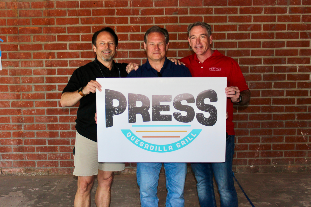 Partners David Glennon, left, Greg Graber and Chip Anderson and their wives are the six partners in Heritage Restaurant Brands in San Luis Obispo. They are also co-owners of the firm’s latest venture, Press Quesadilla Grill in Foothill Plaza.